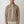 Man wearing a beige jacket with a white background